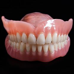 A closeup of two full dentures