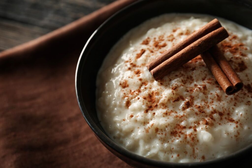 A bowl of festive rice pudding with cinnamon.