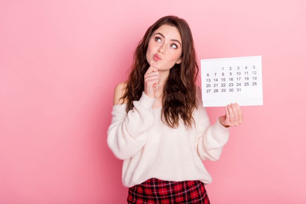 A woman holding a calendar